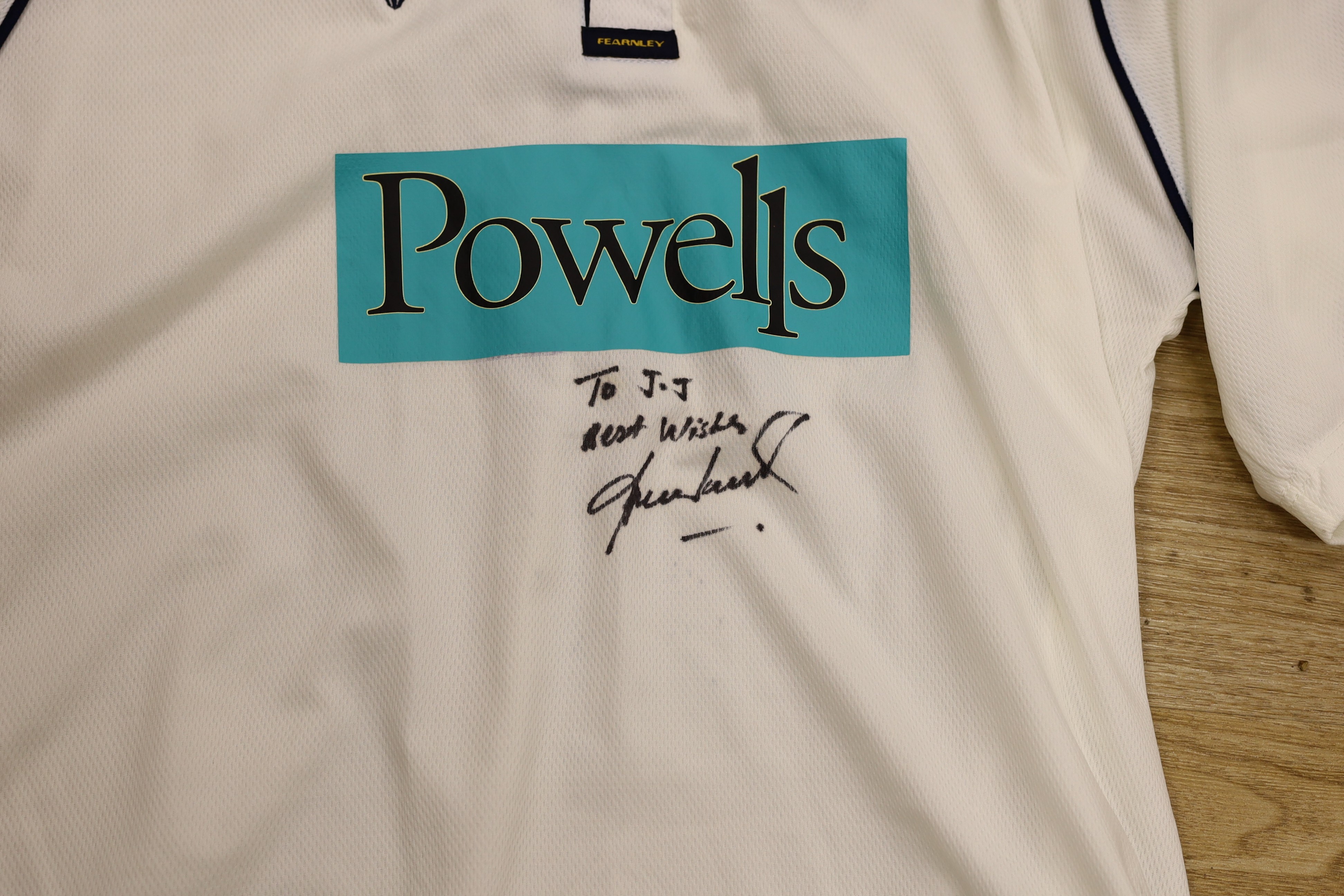 An England Rugby World Cup 2003 shirt signed by Martin Johnson, and two other players and a Hampshire county cricket club shirt signed to JJ best wishes